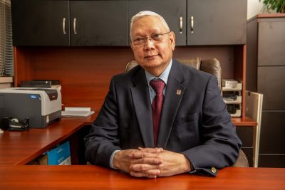 Nathaniel Tablante sitting at his desk.